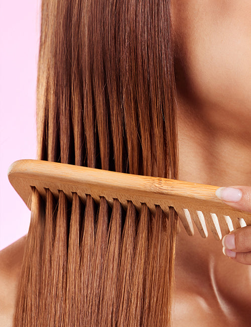 wooden comb sliding smoothly through hair