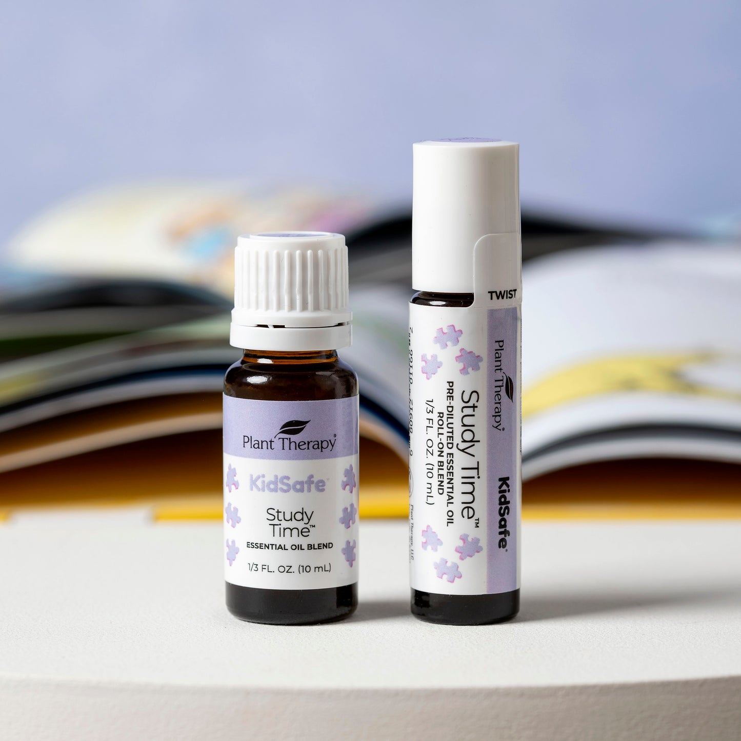 Study Time KidSafe Essential Oil Pre-Diluted Roll-On & Undiluted blend pictured next to textbooks