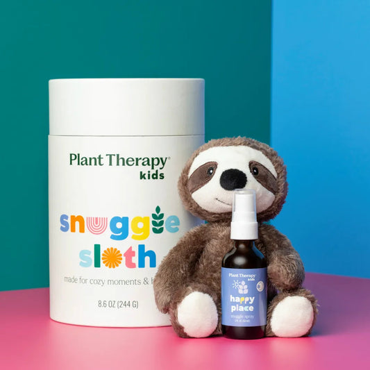 Plant Therapy Kids snuggie sloth with a bottle on a pink and blue background
